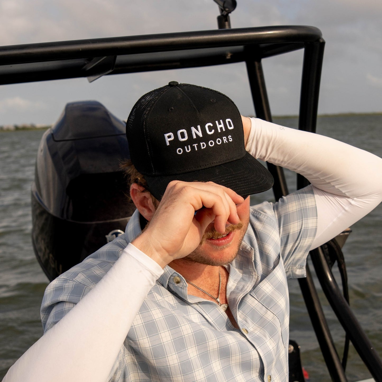 Poncho Outdoors The Man in Black Hat