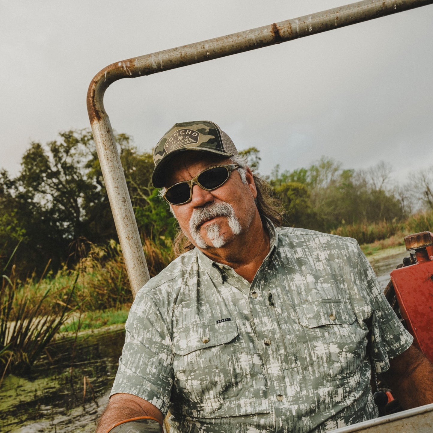 Poncho Outdoors Camo Wild and Free Trucker Hat